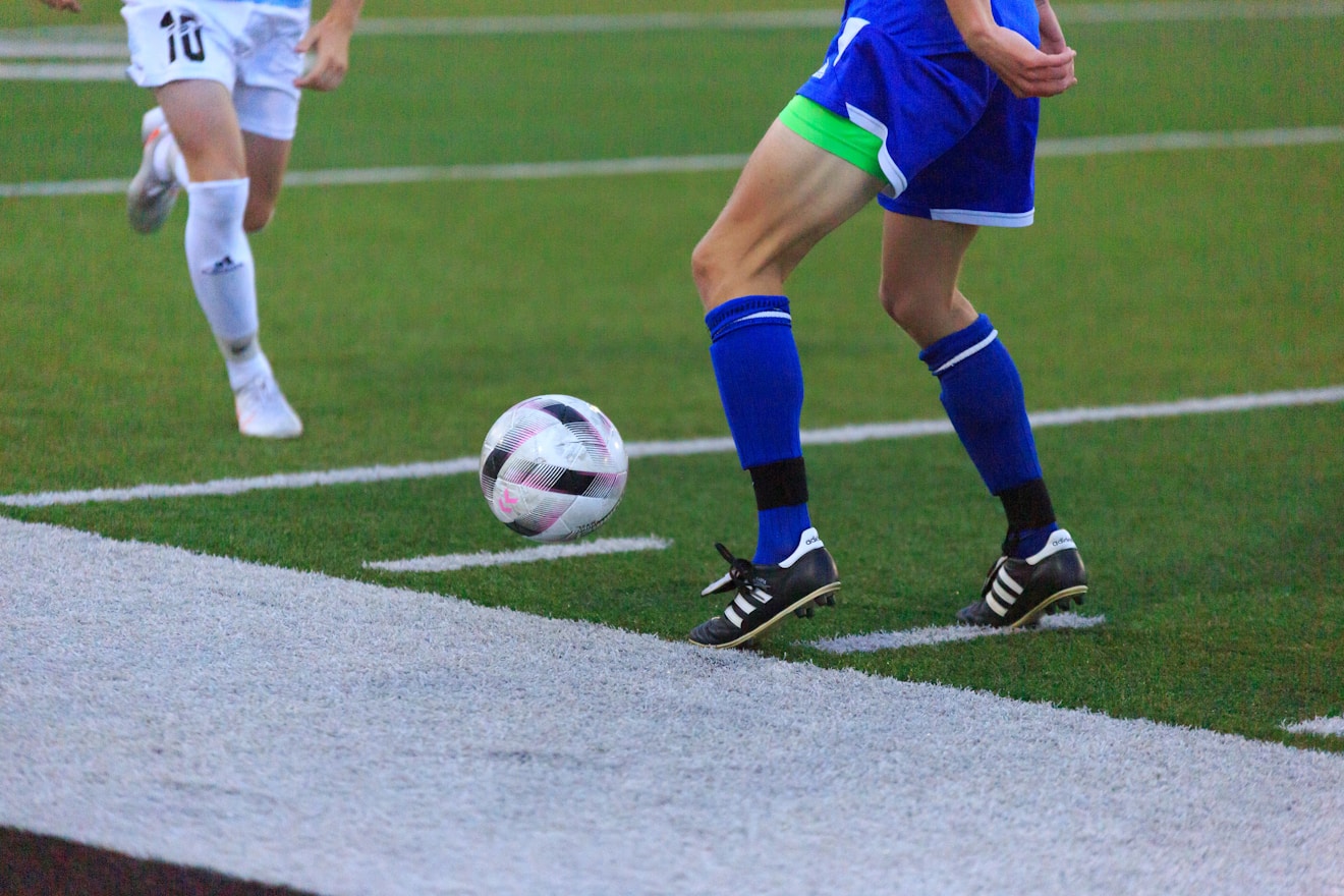 Soccer player's legs with ball